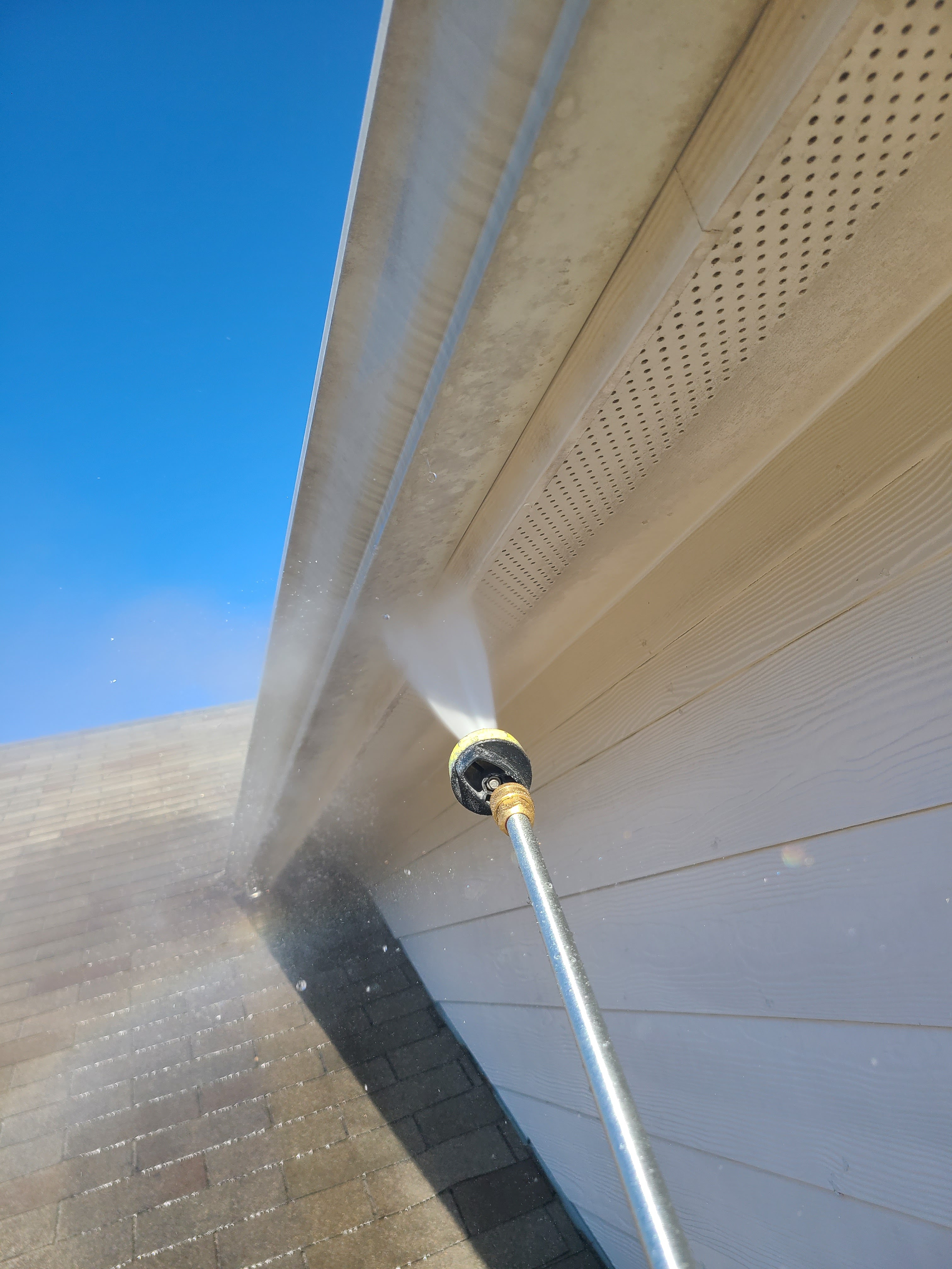 House pressure washing company cleaning home exterior near Houston, TX